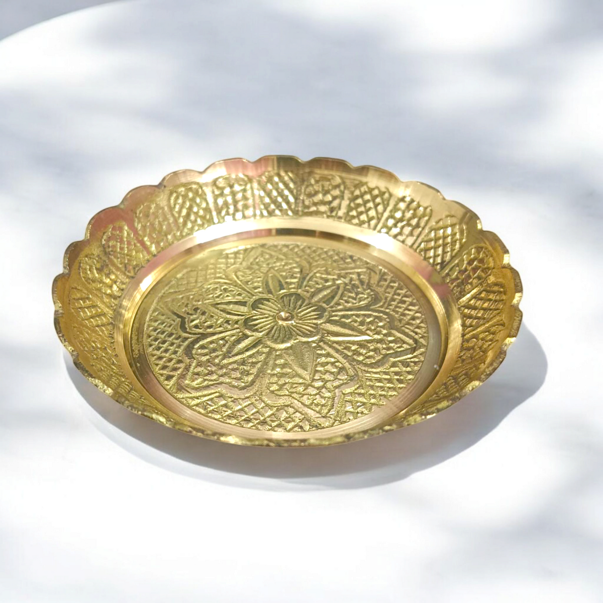 Pure brass flower design plate for temple use, ideal for holding lamps, idols, and religious offerings during pooja ceremonies.

