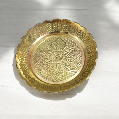 Pure brass flower design plate for temple use, ideal for holding lamps, idols, and religious offerings during pooja ceremonies.

