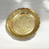 Pure brass flower design plate for temple use, ideal for holding lamps, idols, and religious offerings during pooja ceremonies.

