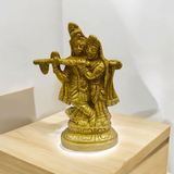 Radha Krishna Brass Idol with intricate detailing, showcasing Lord Krishna playing the flute and Radha in a loving pose.