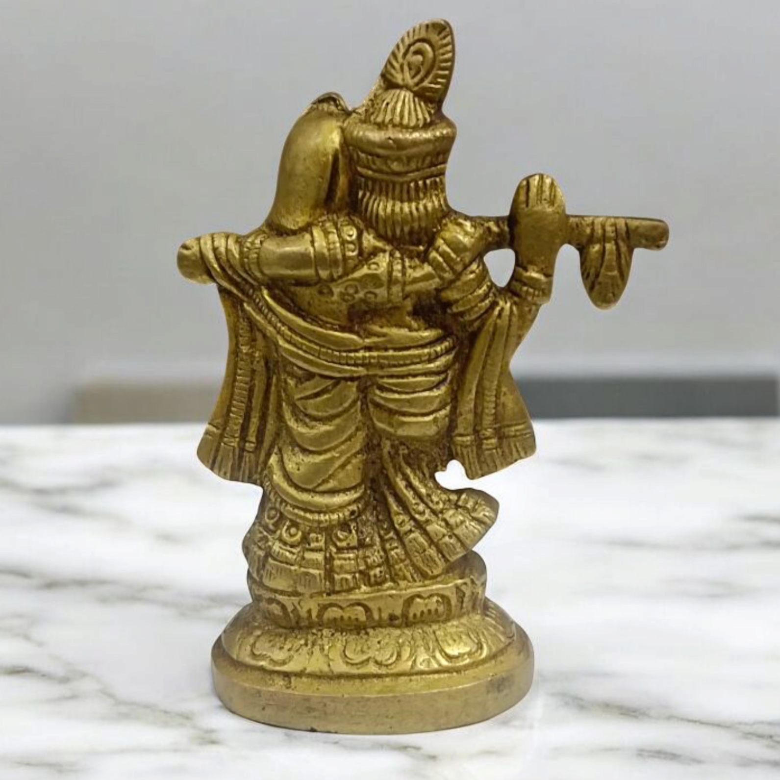 Radha Krishna Brass Idol with intricate detailing, showcasing Lord Krishna playing the flute and Radha in a loving pose.
