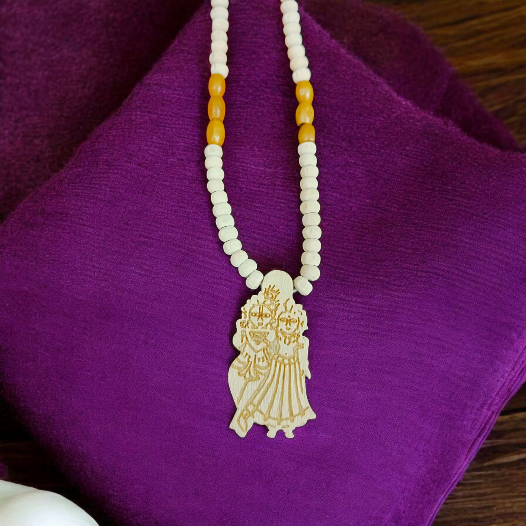 Radha Krishna Tulsi Mala with a pendant, featuring organic Tulsi beads and a pendant with Lord Krishna and Goddess Radha