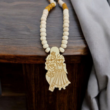 Radha Krishna Tulsi Mala with a pendant, featuring organic Tulsi beads and a pendant with Lord Krishna and Goddess Radha