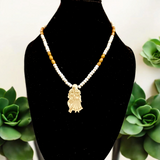 Radha Krishna Tulsi Mala with a pendant, featuring organic Tulsi beads and a pendant with Lord Krishna and Goddess Radha