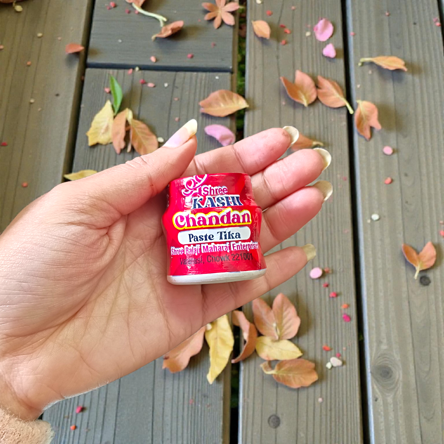 Red chandan paste tika container used for tilak and puja rituals
