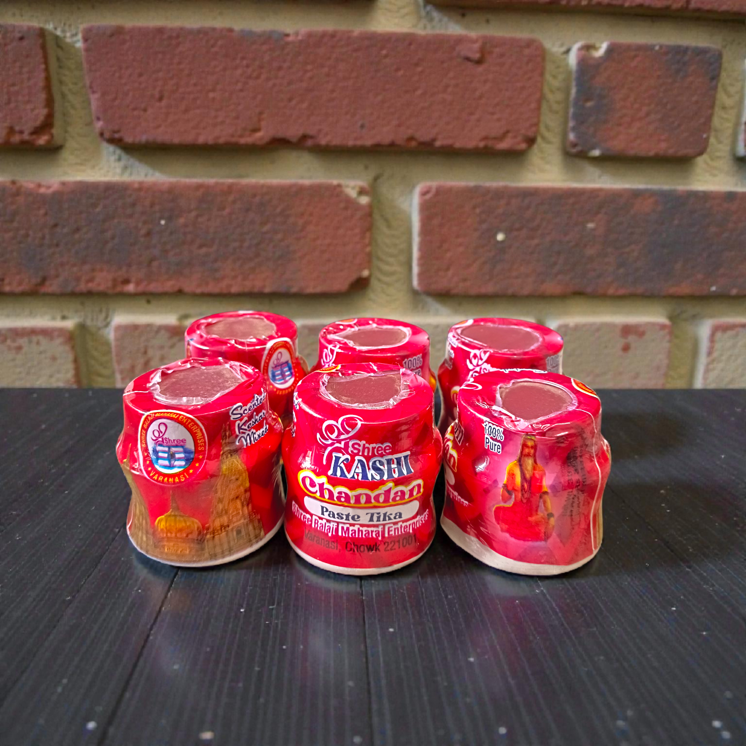 Red chandan paste tika container used for tilak and puja rituals