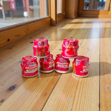 Red chandan paste tika container used for tilak and puja rituals