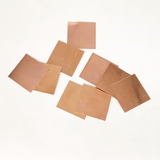 Set of 11 Copper Square Pieces (Copper Patra) used for Vastu correction, spiritual rituals, and energy enhancement.