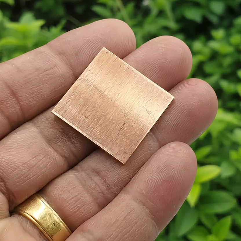 Set of 11 Copper Square Pieces (Copper Patra) used for Vastu correction, spiritual rituals, and energy enhancement.