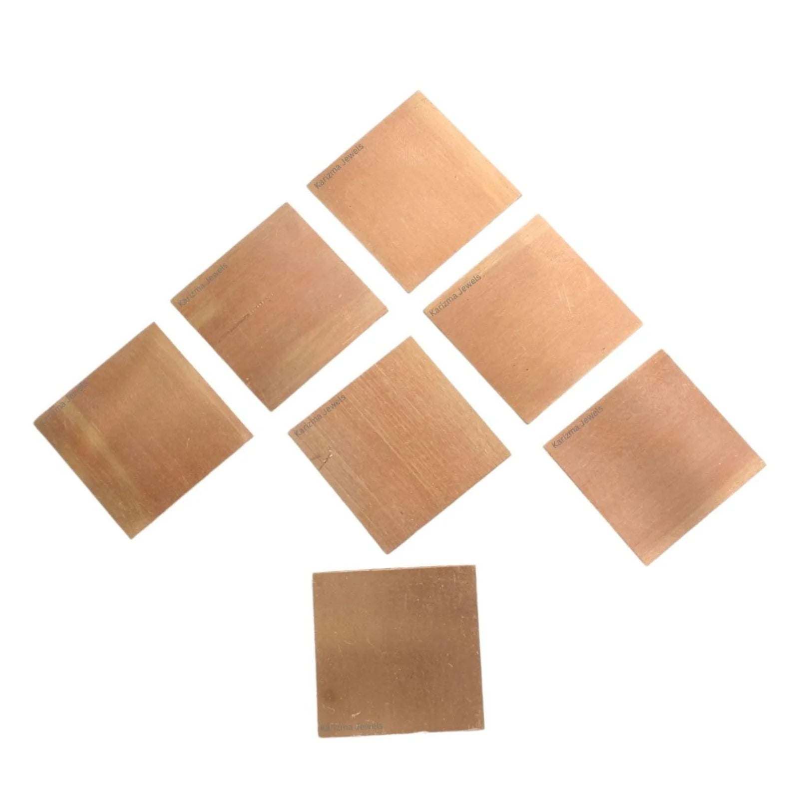 Set of 11 Copper Square Pieces (Copper Patra) used for Vastu correction, spiritual rituals, and energy enhancement.