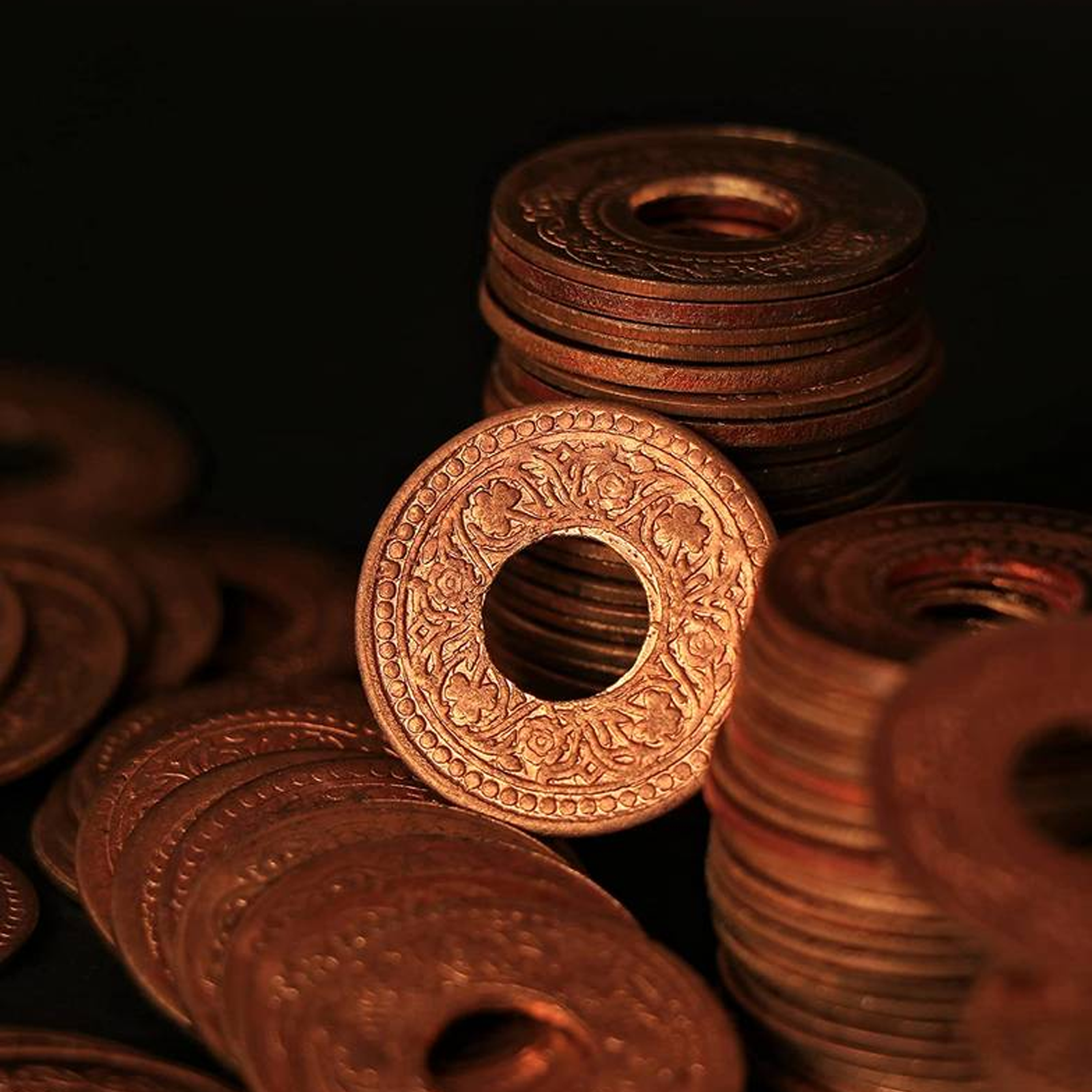 Set of 7 Copper Hole Coins, used in spiritual practices, poojas, and Tantric rituals for protection, prosperity, and positive energy flow.