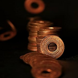 Set of 7 Copper Hole Coins, used in spiritual practices, poojas, and Tantric rituals for protection, prosperity, and positive energy flow.