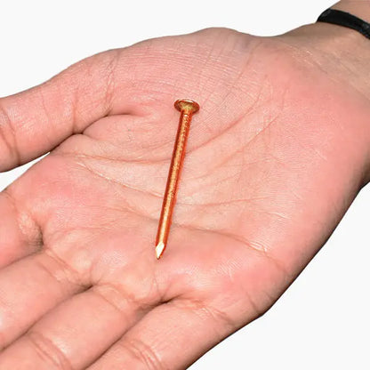 Set of 7 Copper Nails (Tambe Ke Keel) used for spiritual protection, Vastu Shastra rituals, and energy balancing.