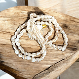 Shankh Mala made of authentic conch shells, 108+1 beads for spiritual healing, meditation, and prayers, lab certified for purity and authenticity.