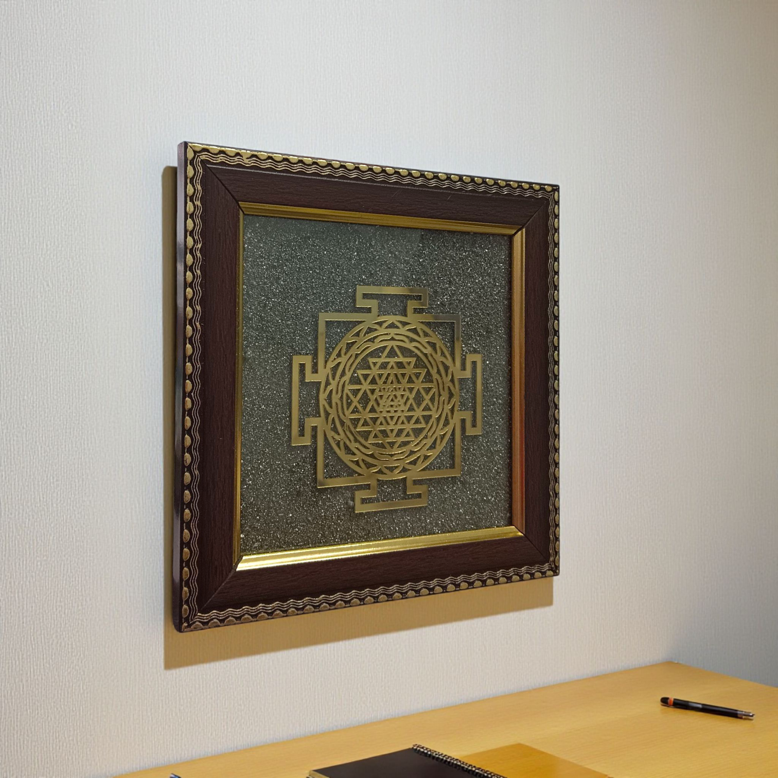 Shree Yantra mounted on raw Pyrite crystal in a wooden Vastu-compliant photo frame for spiritual home and office décor