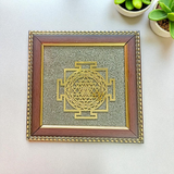 Shree Yantra mounted on raw Pyrite crystal in a wooden Vastu-compliant photo frame for spiritual home and office décor