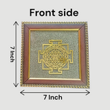 Shree Yantra mounted on raw Pyrite crystal in a wooden Vastu-compliant photo frame for spiritual home and office décor