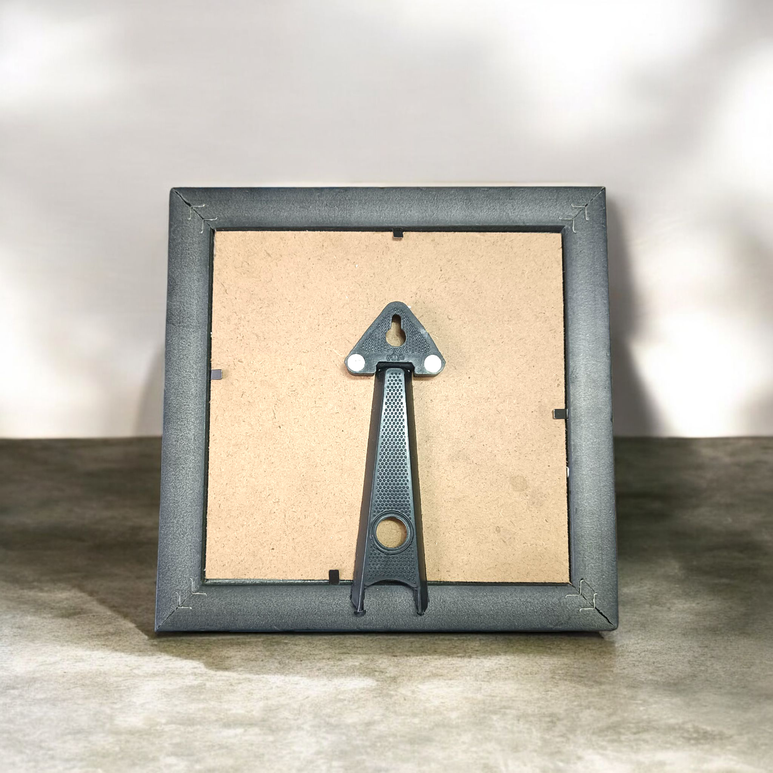 Shree Yantra mounted on raw Pyrite crystal in a wooden Vastu-compliant photo frame for spiritual home and office décor