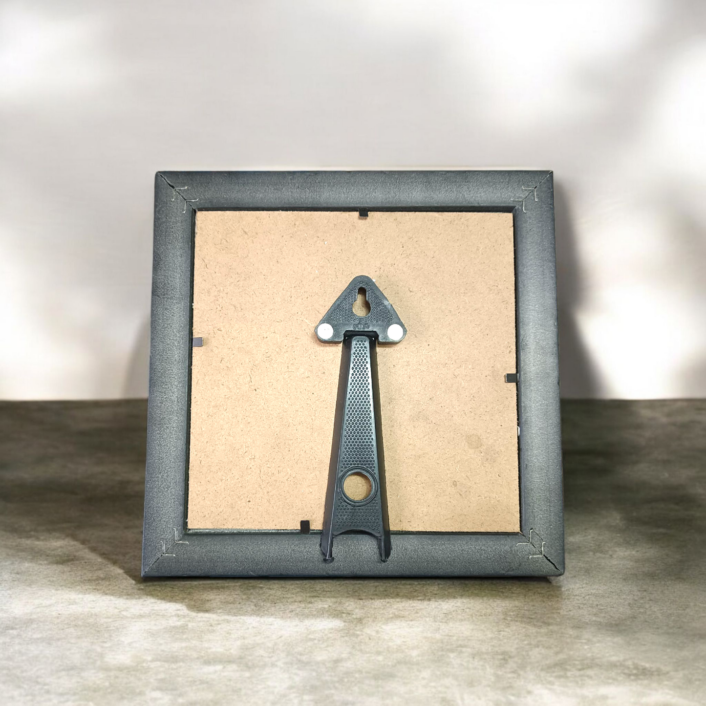 Shree Yantra mounted on raw Pyrite crystal in a wooden Vastu-compliant photo frame for spiritual home and office décor