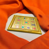 Shri Sampoorna Kalsarp Yantra with gold plating and frame, designed to remove Kalsarp Dosh and bring prosperity, success, and protection