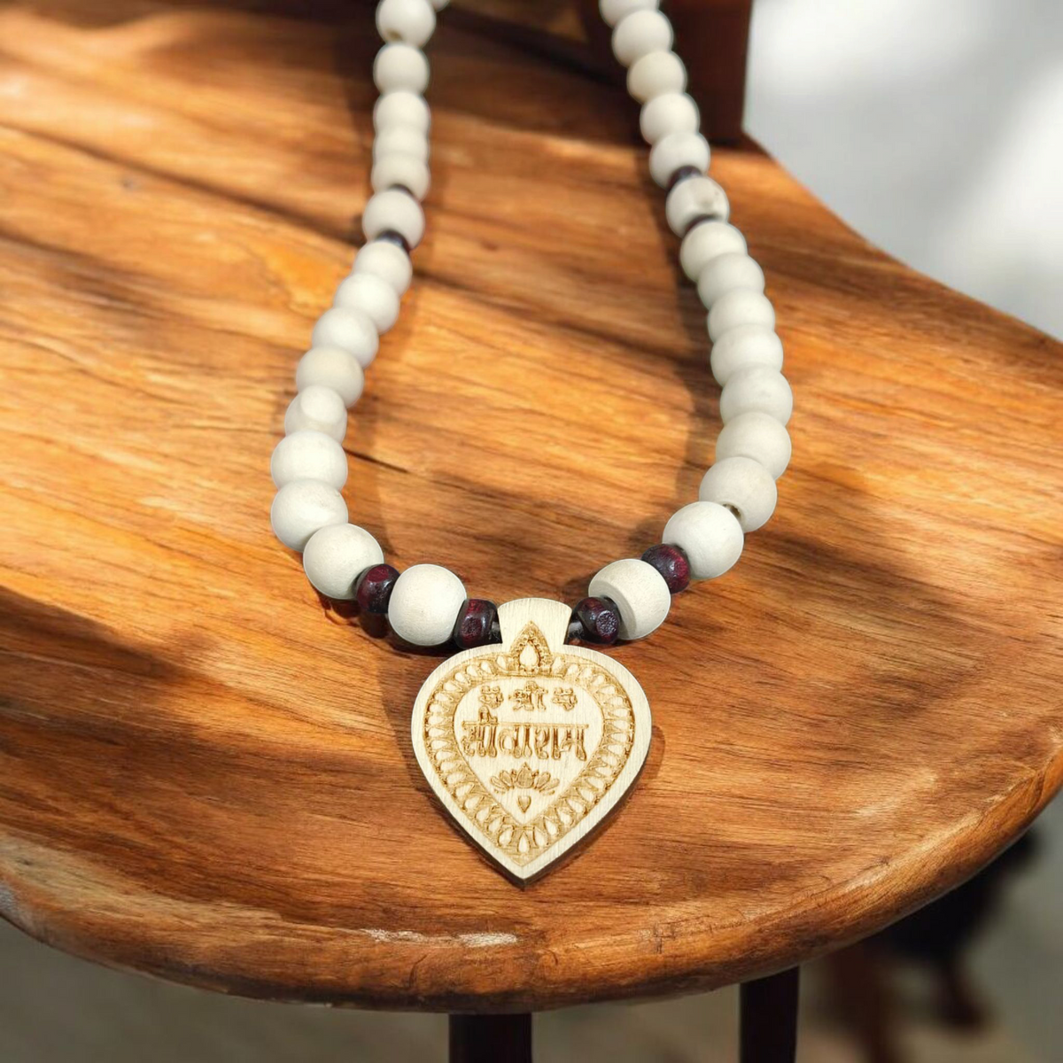 Shri Sita Ram Tulsi Locket In Tulsi Mala displayed with a close-up view of the sacred beads and the elegant locket featuring Lord Ram and Goddess Sita