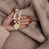 Shri Sita Ram Tulsi Locket In Tulsi Mala displayed with a close-up view of the sacred beads and the elegant locket featuring Lord Ram and Goddess Sita