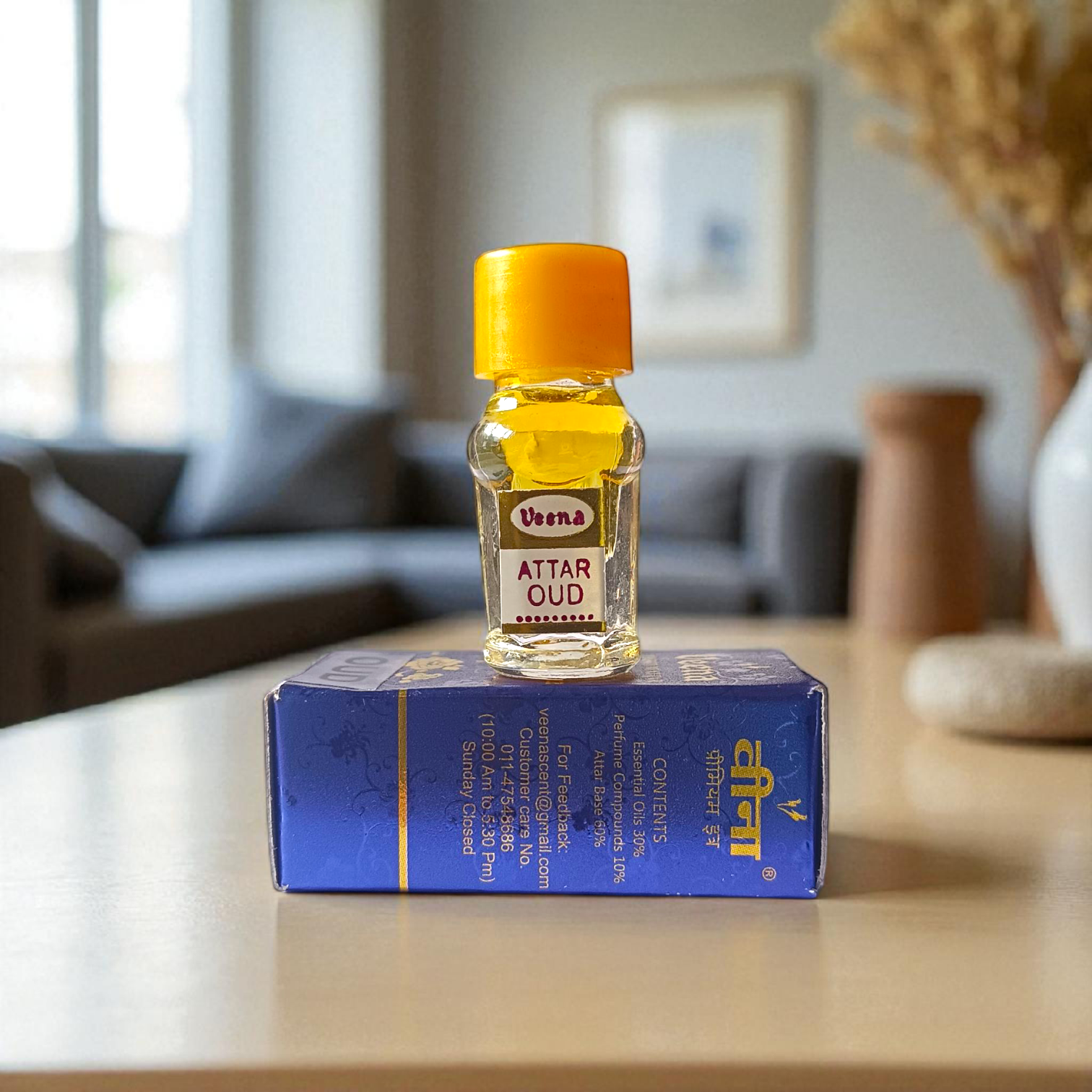 Small 2ML glass bottle of premium natural OUD Attar by Veena with elegant packaging, ideal for daily and spiritual use