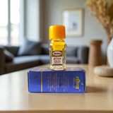 Small 2ML glass bottle of premium natural OUD Attar by Veena with elegant packaging, ideal for daily and spiritual use