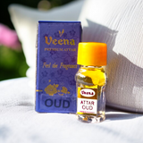 Small 2ML glass bottle of premium natural OUD Attar by Veena with elegant packaging, ideal for daily and spiritual use