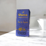 Small 2ML glass bottle of premium natural OUD Attar by Veena with elegant packaging, ideal for daily and spiritual use