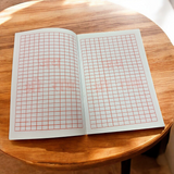The Ram Naam Lekhan Book featuring sacred spaces to write the name of Shri Ram 25,000 times, symbolizing a deep spiritual connection with the divine.