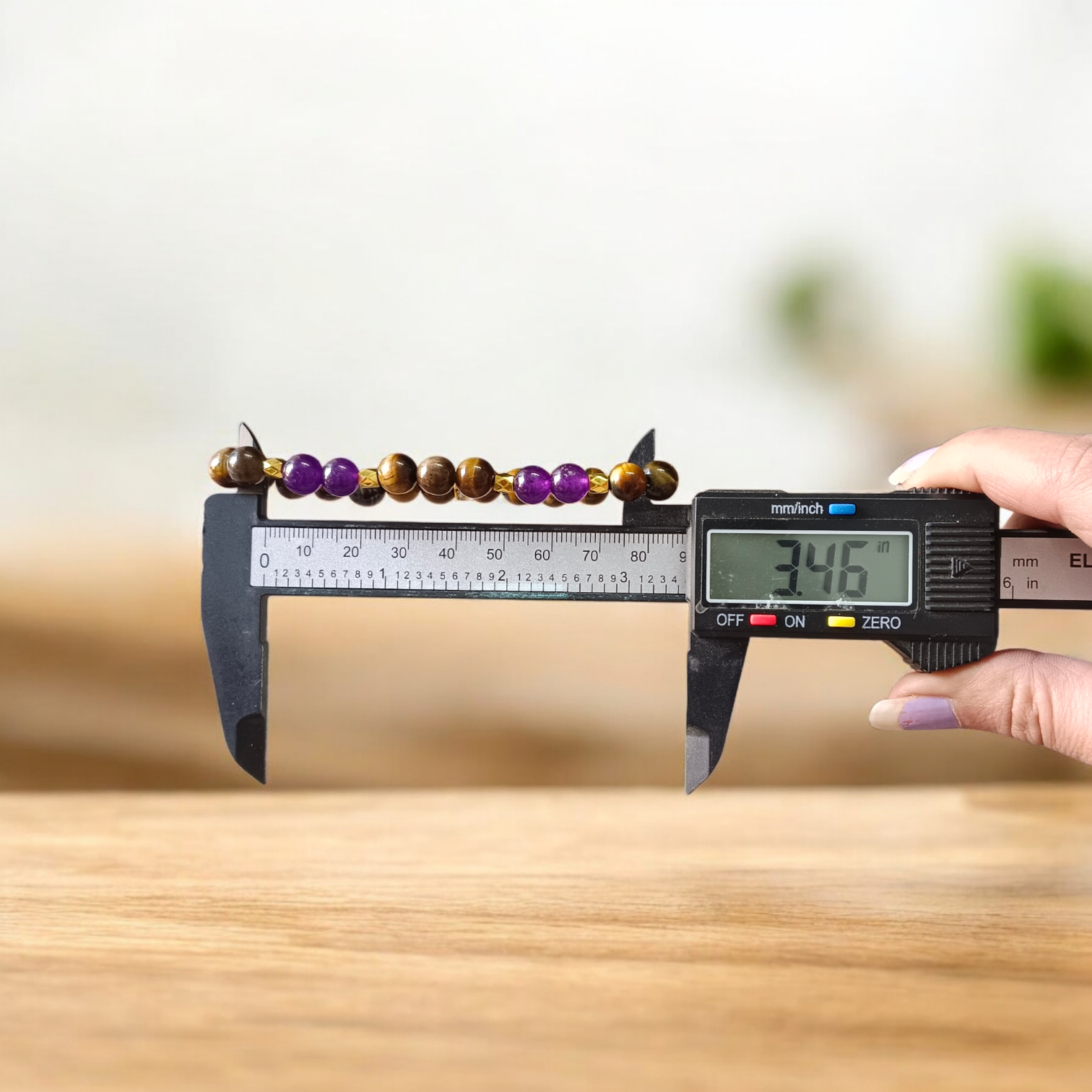 Tiger Eye and Amethyst Bracelet with 8mm polished beads on a white background, stretchable and lab certified