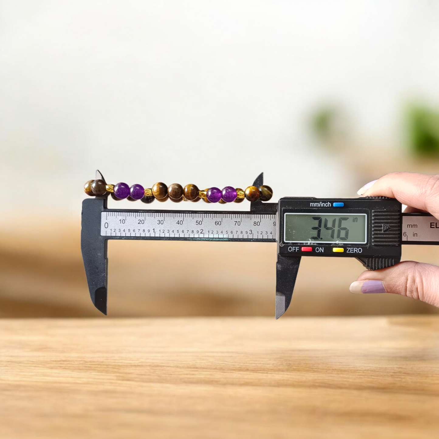 Tiger Eye and Amethyst Bracelet with 8mm polished beads on a white background, stretchable and lab certified