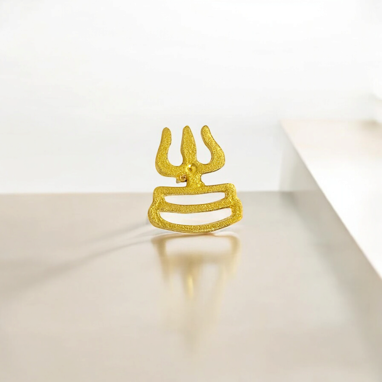 Trishakti Trisul Tilak Stamp applied on the forehead, providing a soothing and cooling effect, symbolizing spiritual protection and blessings.