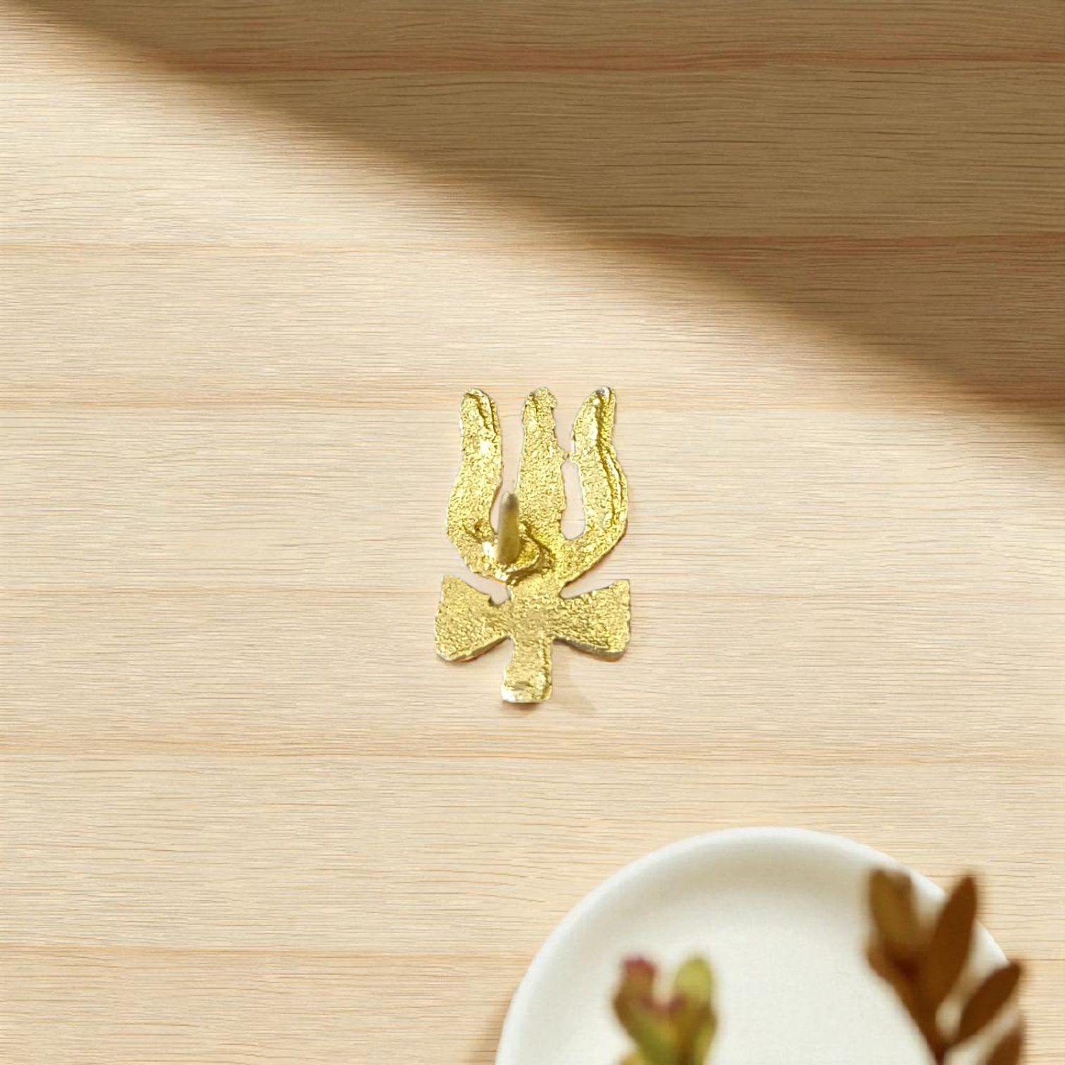 Trishul and Damru Tilak Stamp applied to the forehead, symbolizing divine protection and connection with Lord Shiva