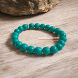 Turquoise Bracelet with smooth, 8MM natural turquoise beads, stretchable design with certificate, promoting balance, healing, and communication.