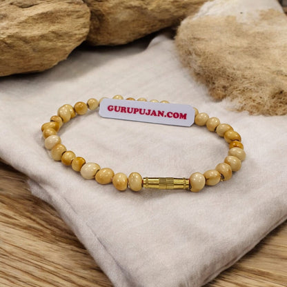 White Gunja Bracelet made from natural white Ratti beads with a secure screw lock design, Lab Certified for authenticity.