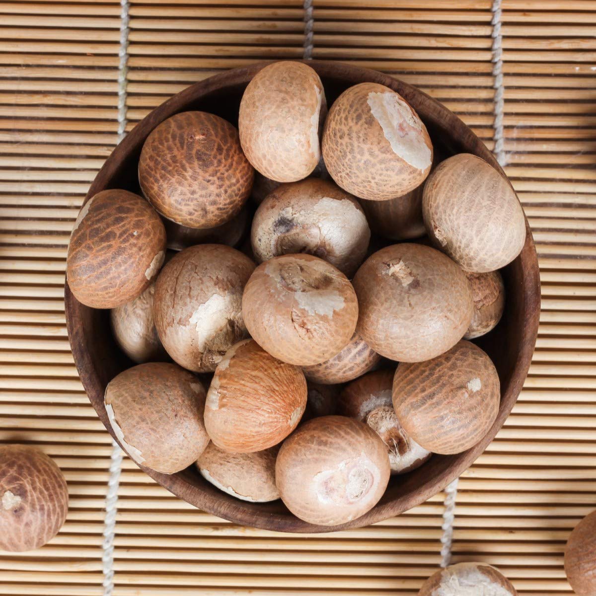 Whole white betel nuts (Sabut Supari) used for health remedies, oral care, and religious rituals, offering natural digestive and energizing benefits.