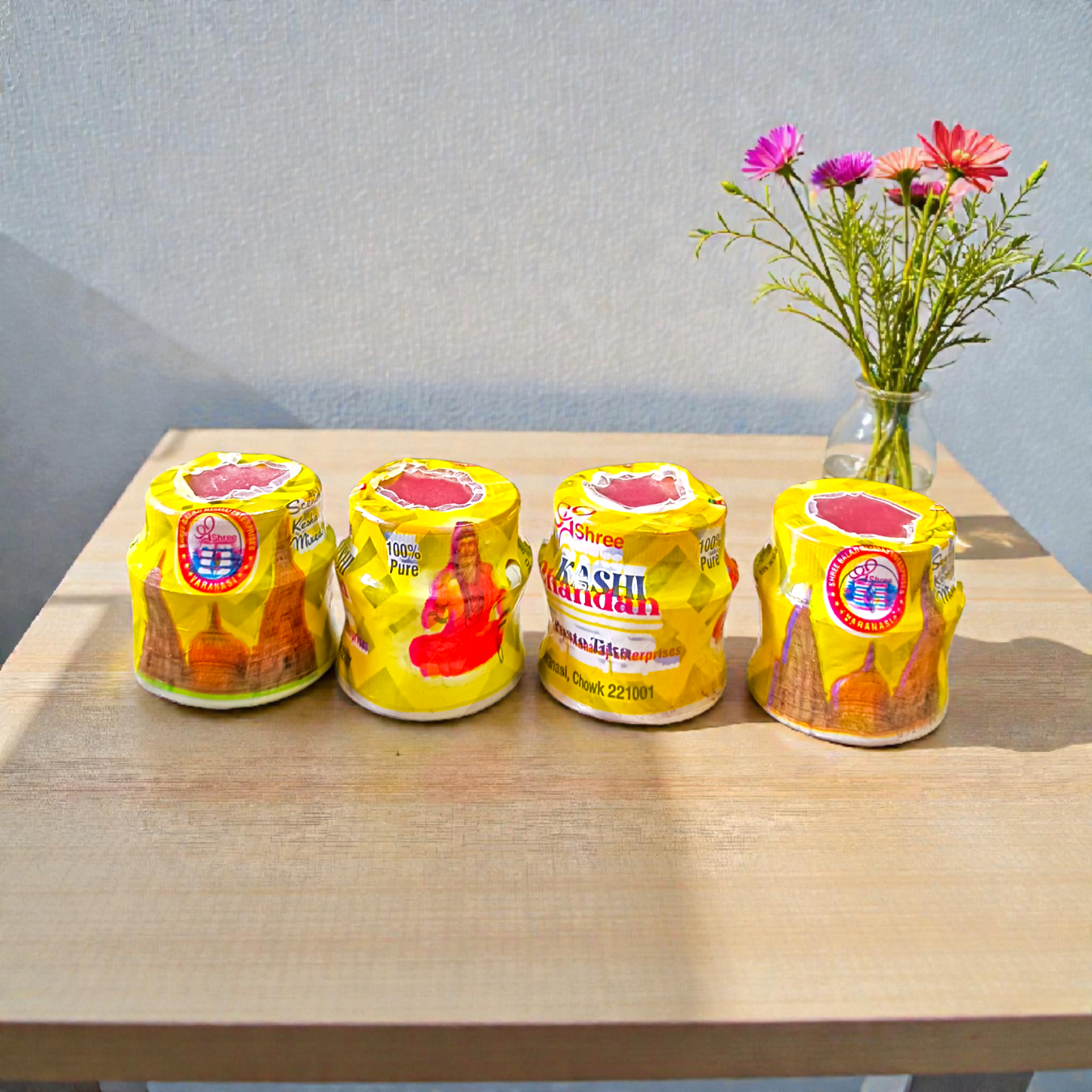 Yellow chandan paste tika container used for puja and tilak rituals
