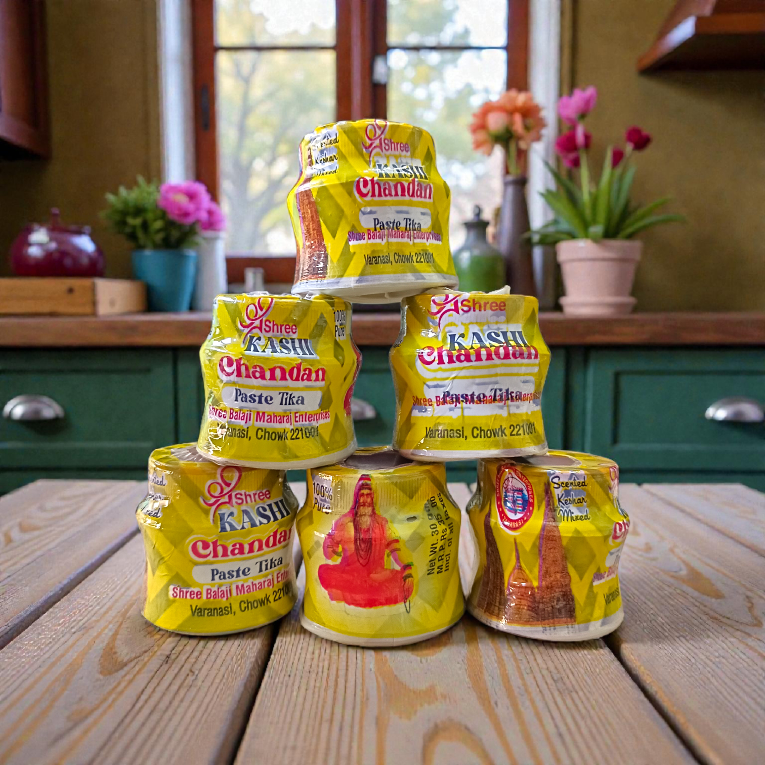 Yellow chandan paste tika container used for puja and tilak rituals