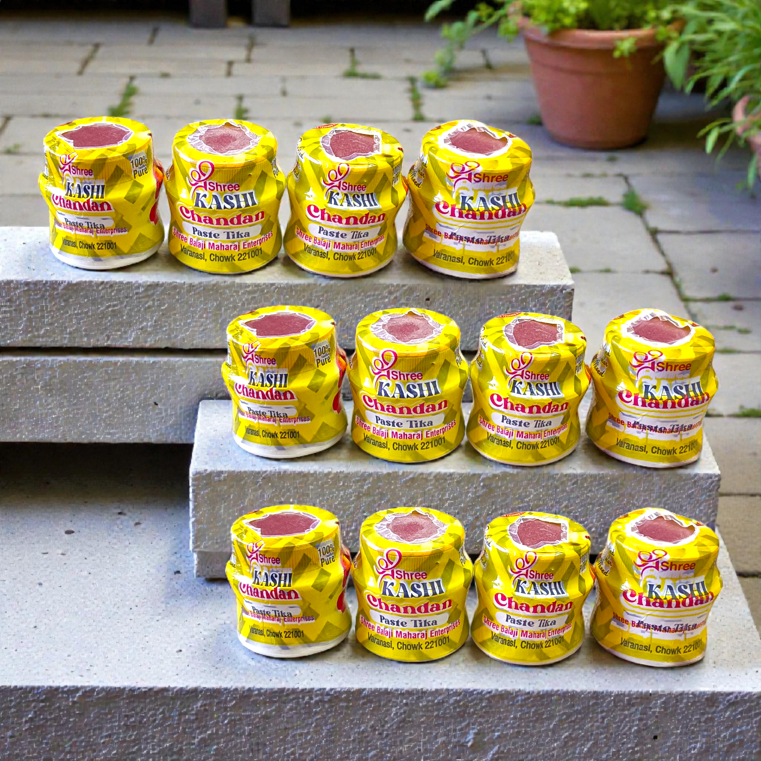 Yellow chandan paste tika container used for puja and tilak rituals