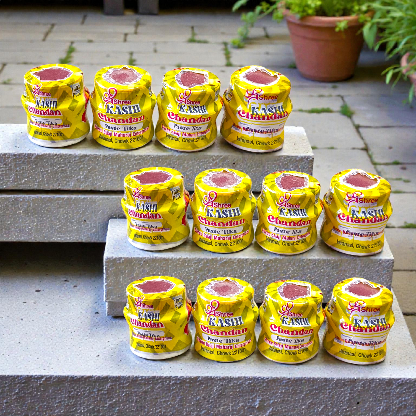 Yellow chandan paste tika container used for puja and tilak rituals