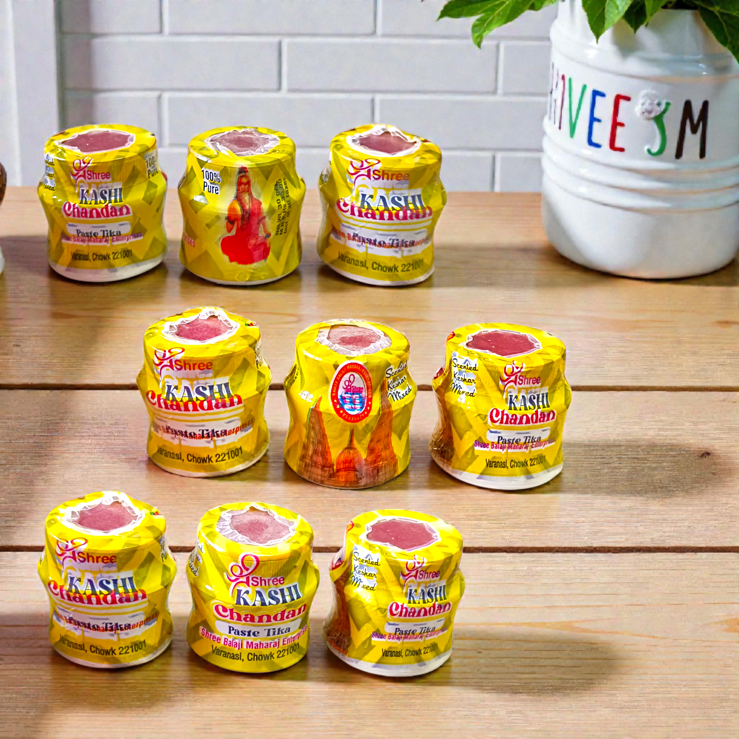 Yellow chandan paste tika container used for puja and tilak rituals
