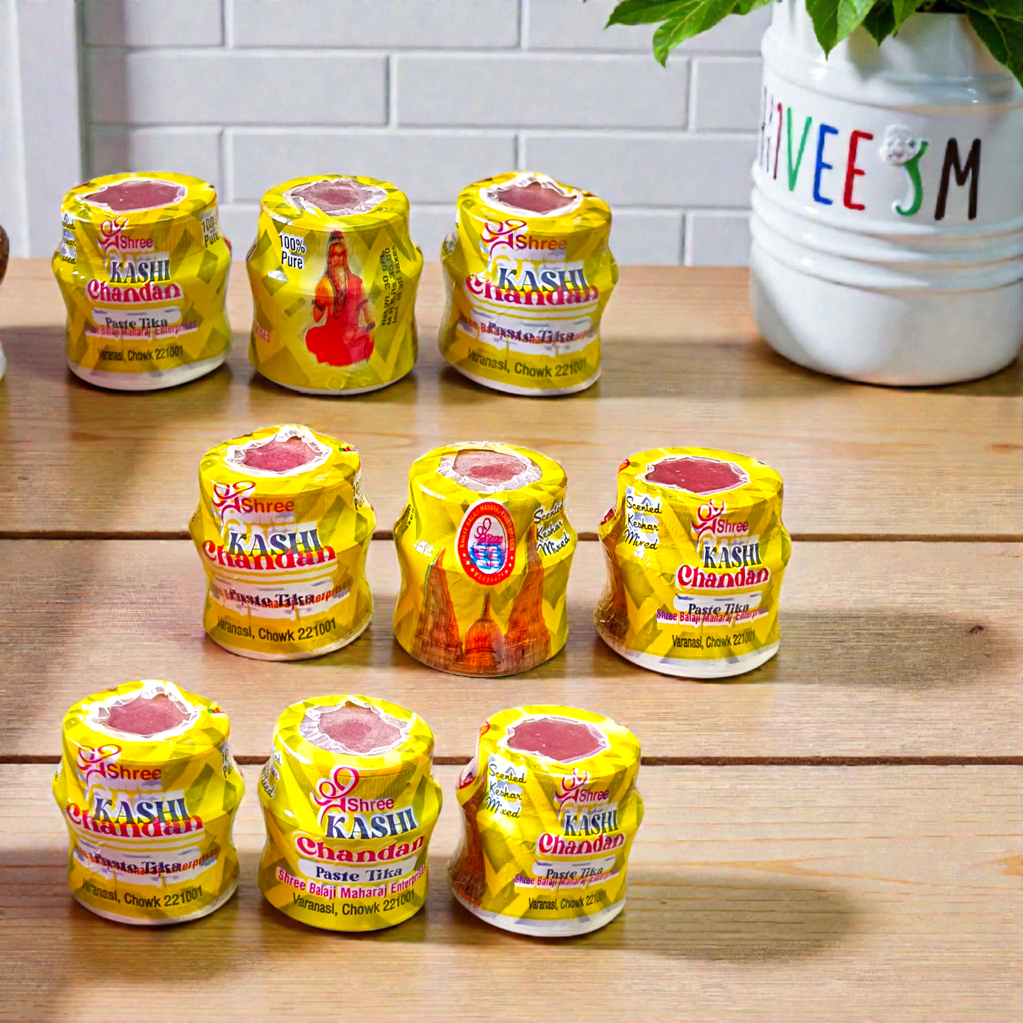 Yellow chandan paste tika container used for puja and tilak rituals