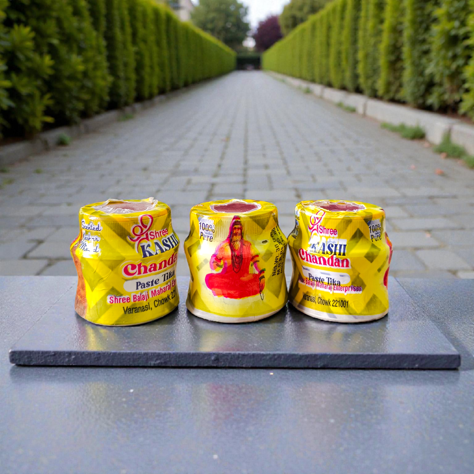 Yellow chandan paste tika container used for puja and tilak rituals