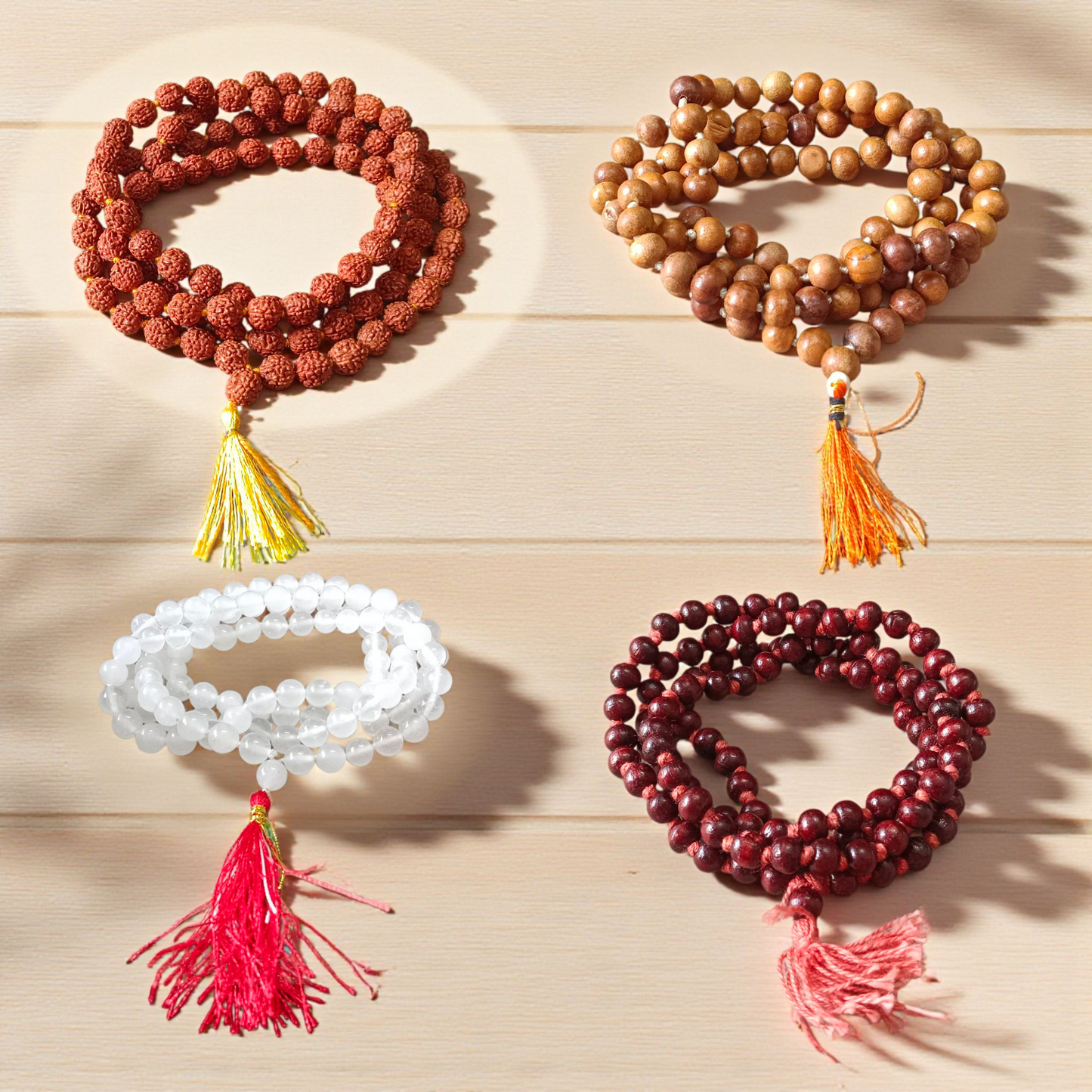 mage showing a Combo of 4 Jaap Malas (Rudraksha, Sphatik, Red &amp; White Chandan) placed neatly with 108+1 beads in each, ideal for meditation and chanting